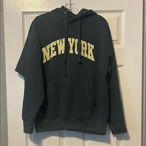 Go For It Apparel dark green hoodie with New York.